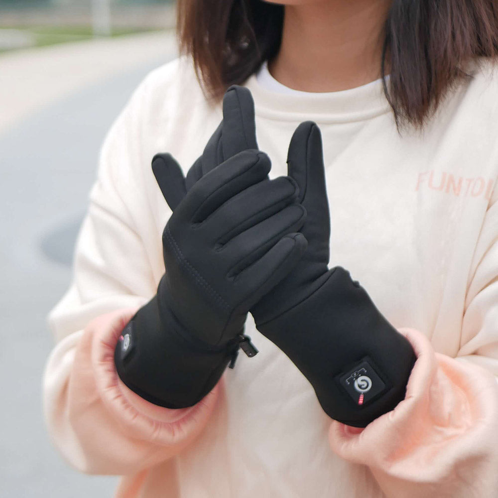 A young lady wearing black SAVIOR thin heated gloves