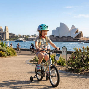 A girl riding a bicycle with the Sydney Opera House in the background