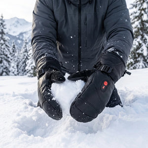 Person wearing savior heated mittens in a snowy landscape